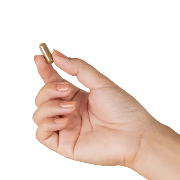 A single Olah brand hemp powered ancient immunity capsule held between thumb and index finger
